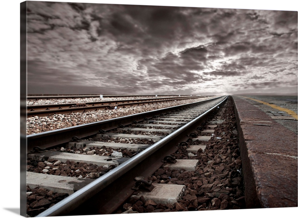 empty-railroad-tracks-with-stormclouds.jpg