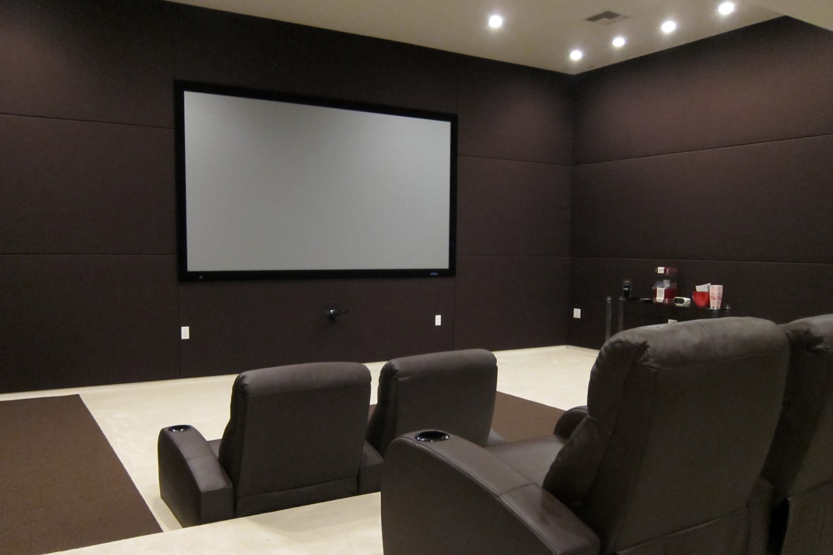 photo-of-high-end-home-theater-with-triple-band-acoustic-fabric-wall-finishing-using-brown-fab...jpg
